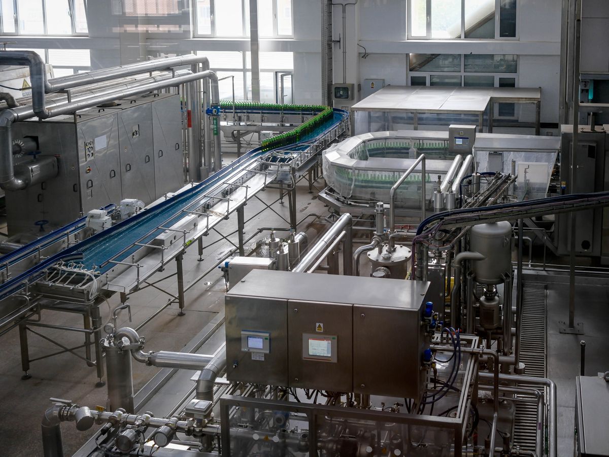 Interior of an automated bottle production line in a manufacturing facility