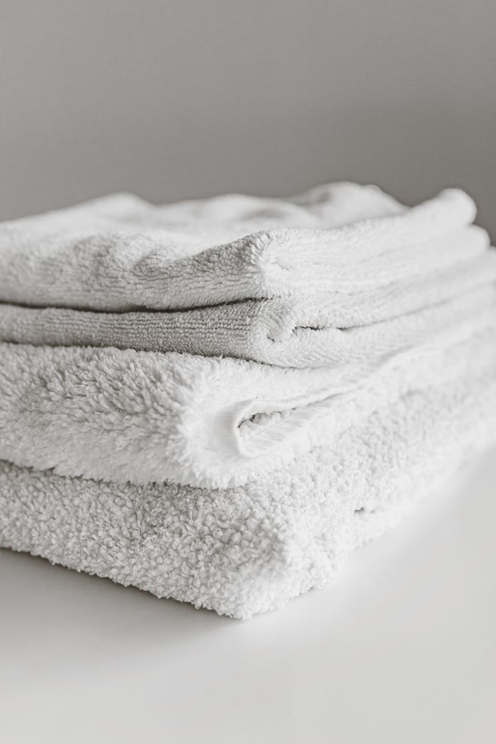 A stack of neatly folded white towels